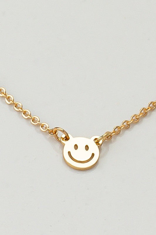 mini smiley face on a delicate chain necklace